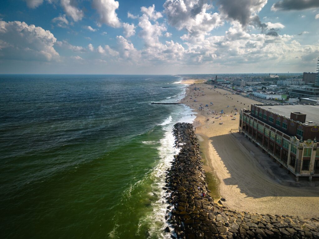 Drone of a building in Asbury Park Beach Boardwalk New Jersey by the Atlantic Ocean