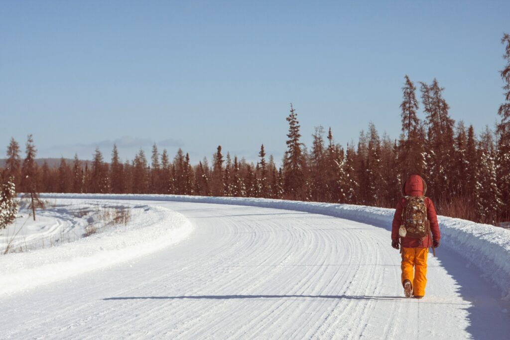 Person walking on snow covered road, Fairbanks, Alaska